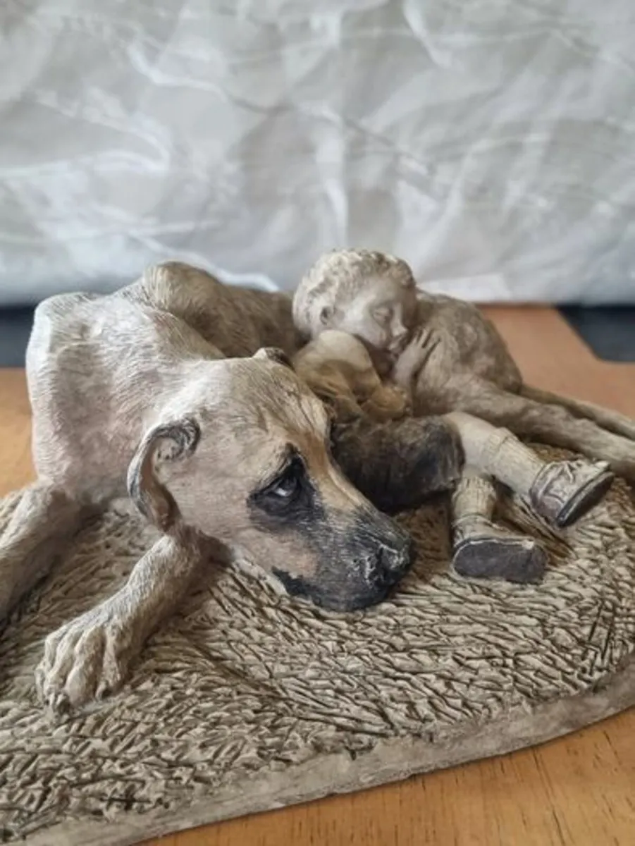 Sculpture of a boy sleeping with a dog - Image 4