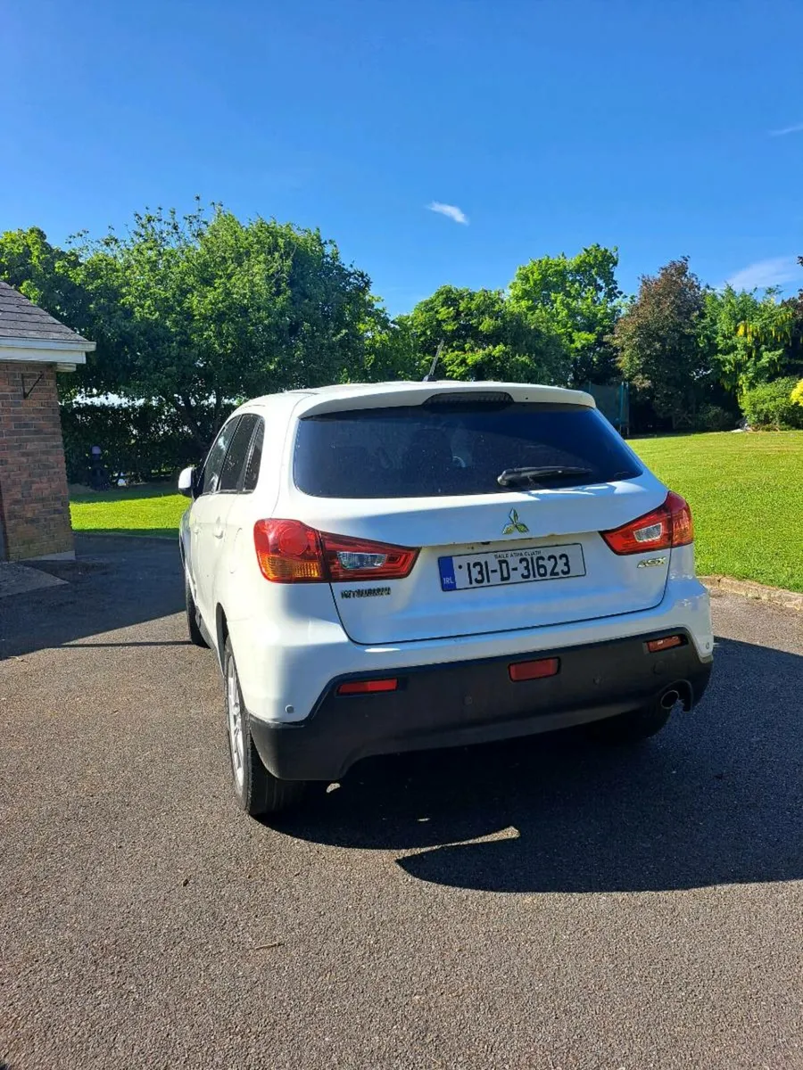 131 White Mitsubishi - Image 1
