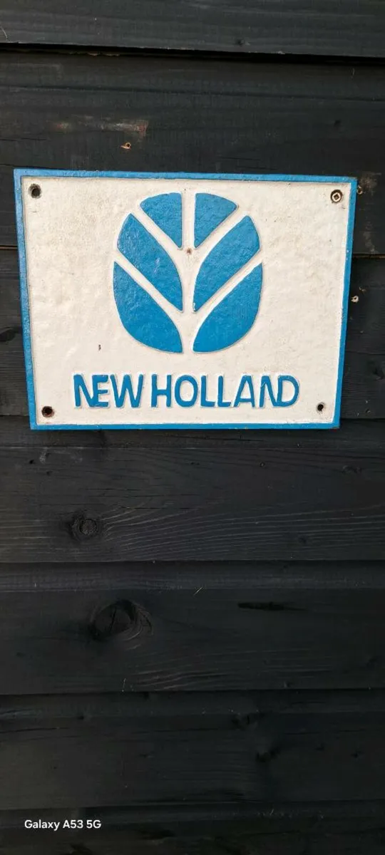 New Holland cast iron sign