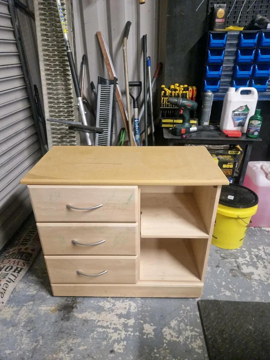 Chest of drawers with open space.
