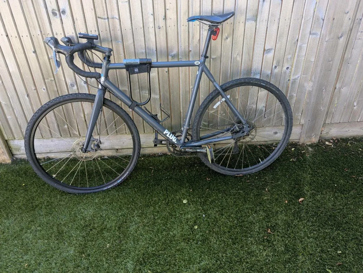 XL Commuter bike - charge plug disc - Image 1
