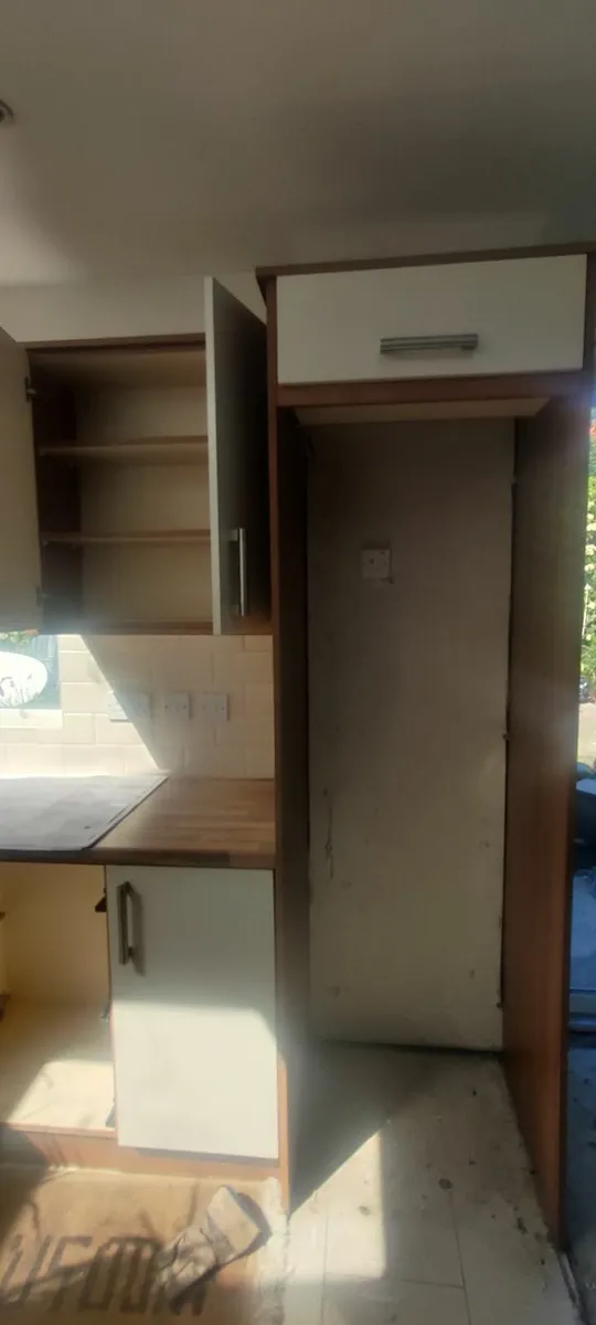 Kitchen cabinets with hob, fan, fridge freezer - Image 3