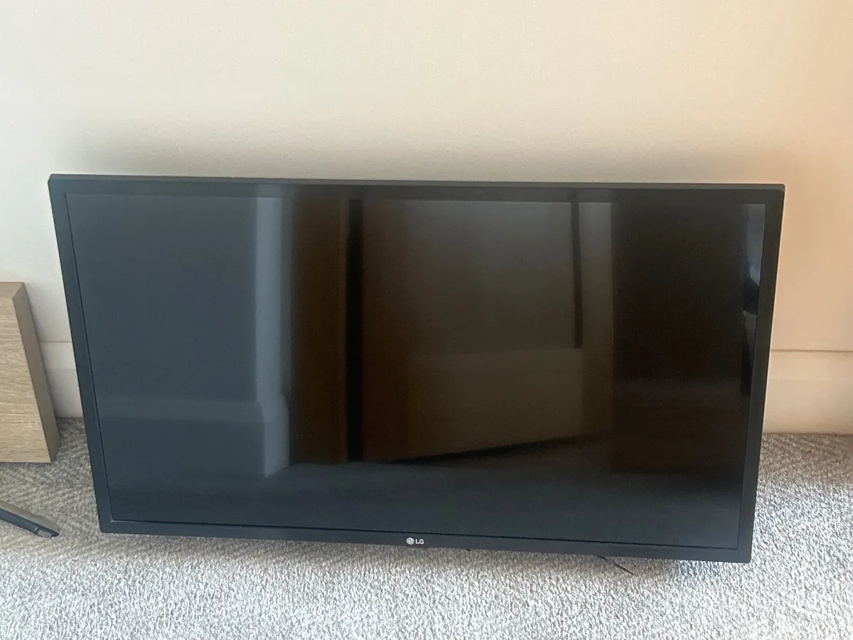 Lg 32” Smart TV  with wall mount - Image 1