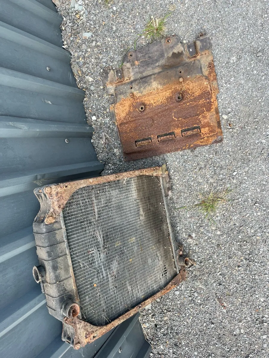 110-90 Radiator and Battery Tray - Image 1
