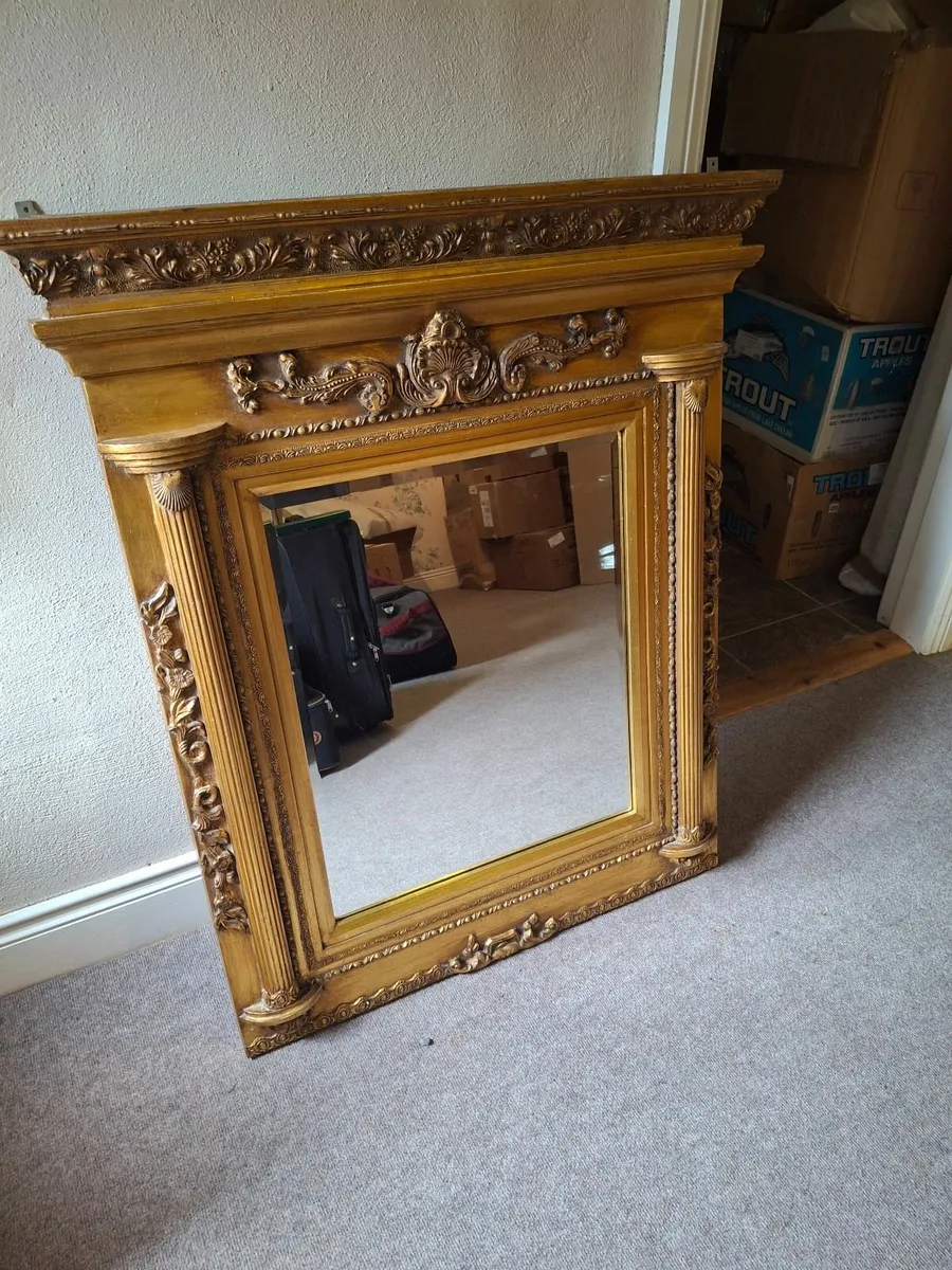 Ornate gold wooden mirror