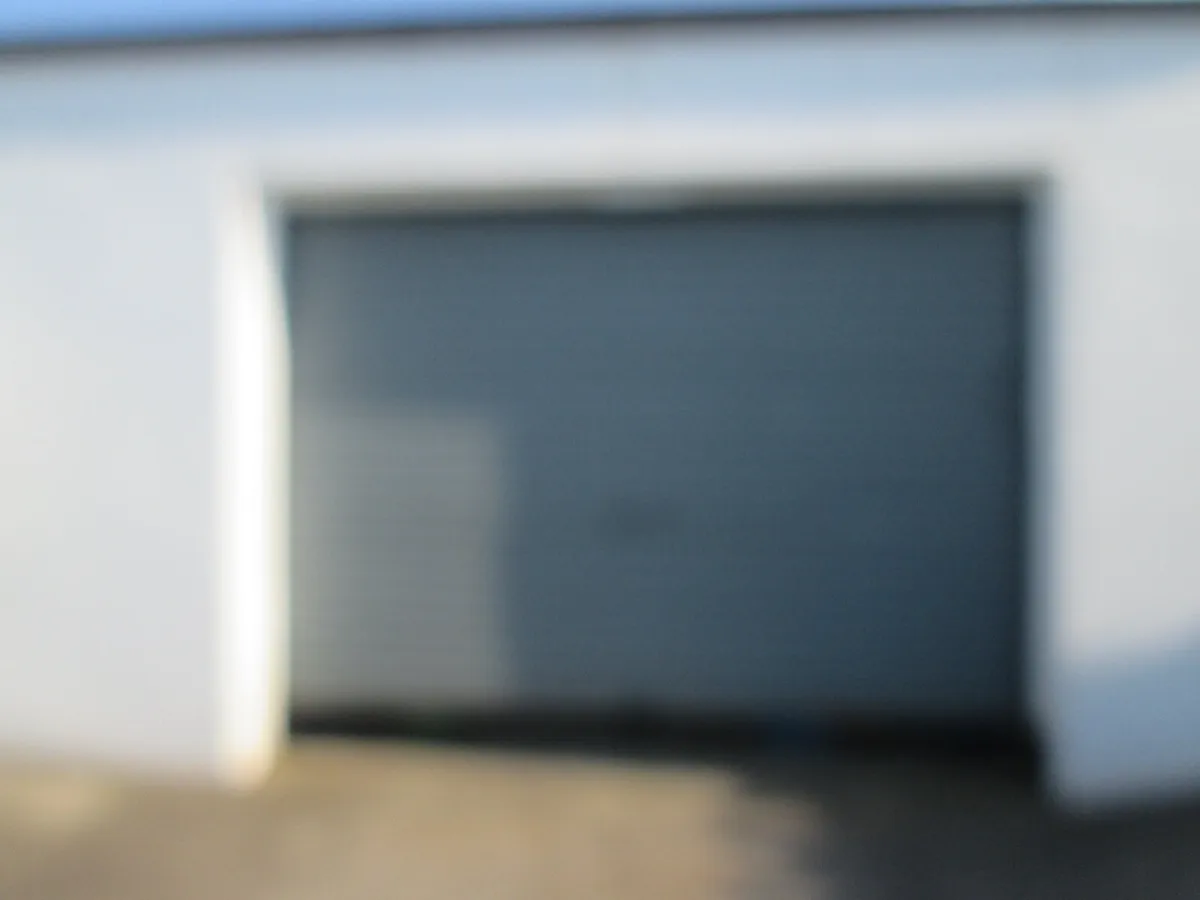 12 X 9 FT.  REMOTE ELECTRIC GARAGE DOOR - Image 1