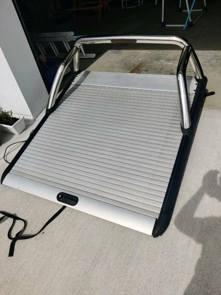 Nissan Navara Roller Shutter Cover with chrome Bar - Image 1