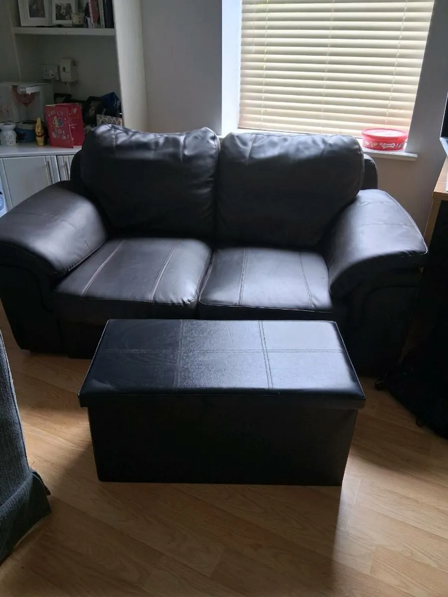 Two seater leather couch & footstool/storage box - Image 1