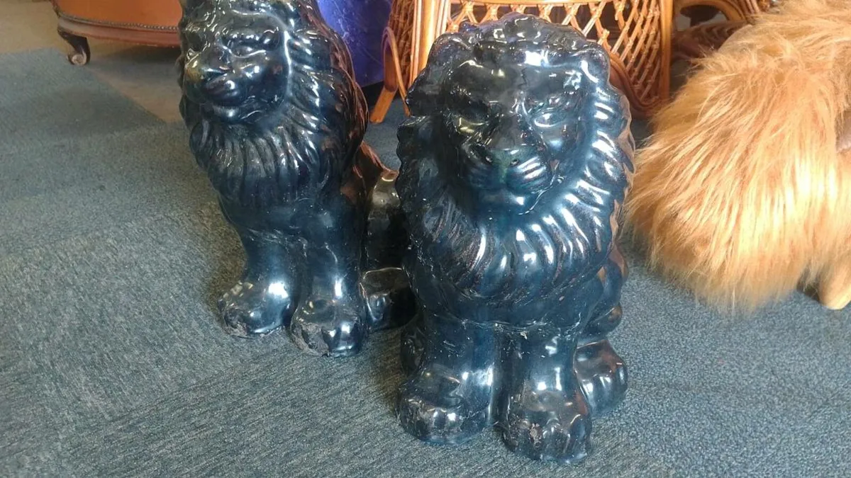 Pair Of Decorative Black Stoneware Lions - Image 1
