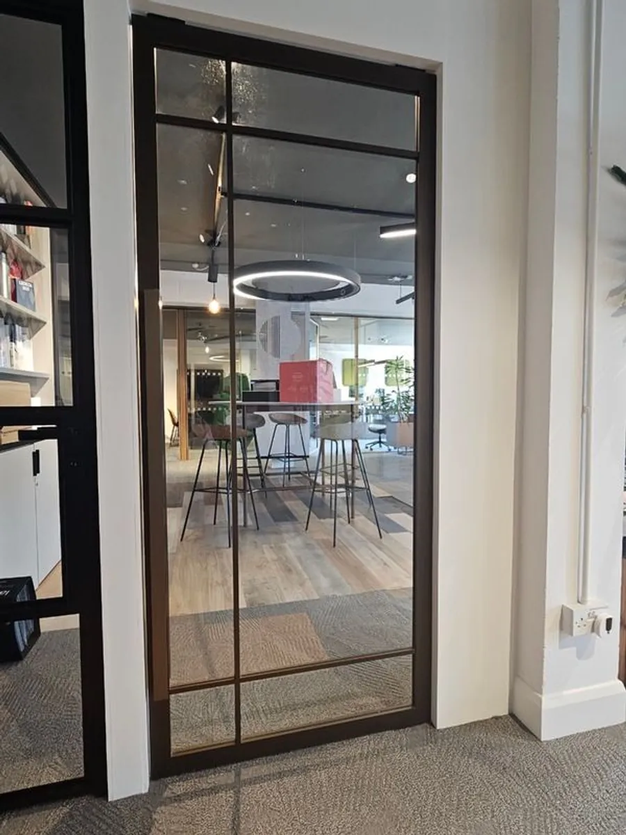 Metal Framed Pivot Doot for Sale - Bronze Finish - Image 1