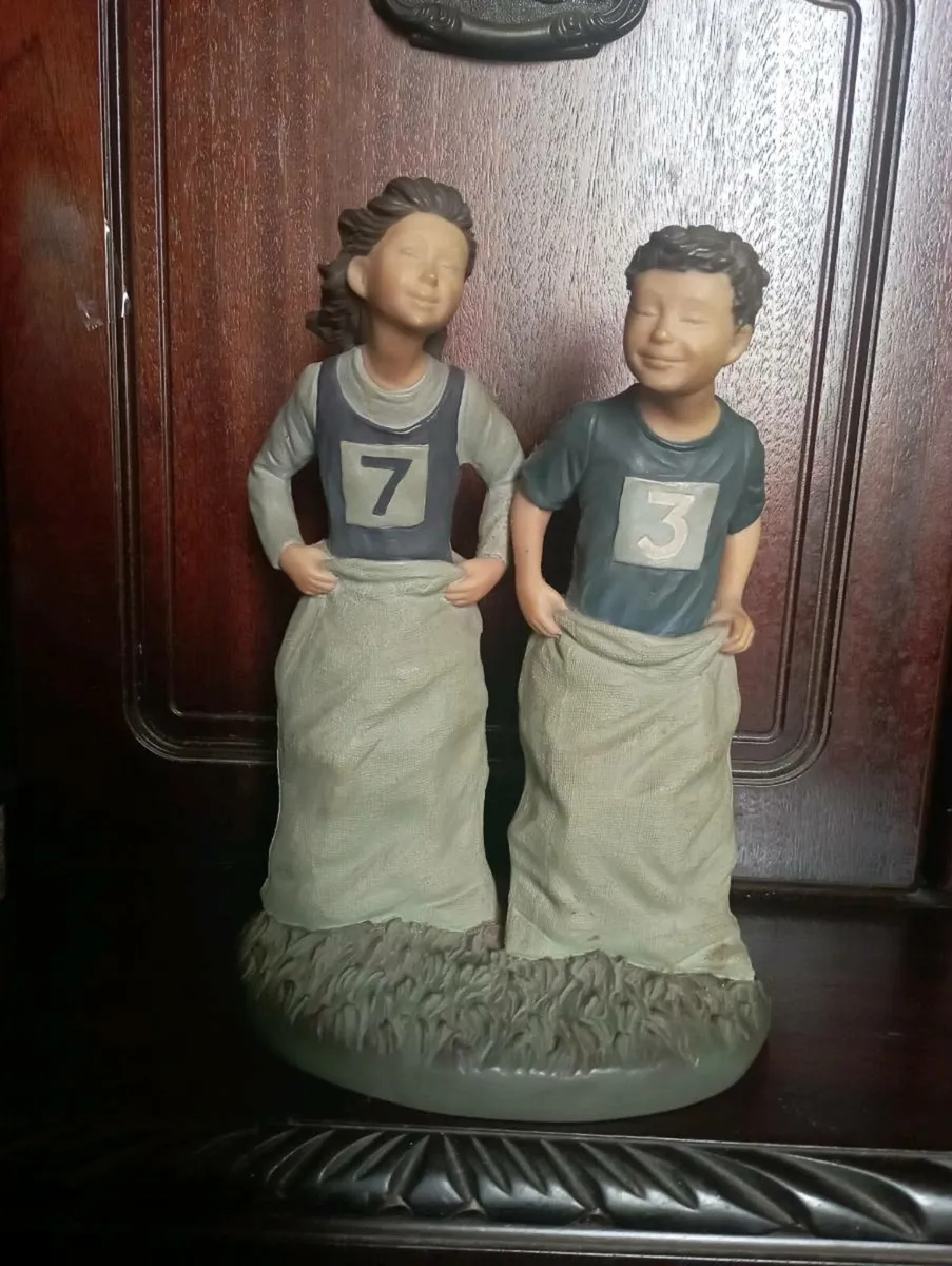 SACK RACE  STONE SCULPTED FIGURE OF BOY &  GRIL - Image 1