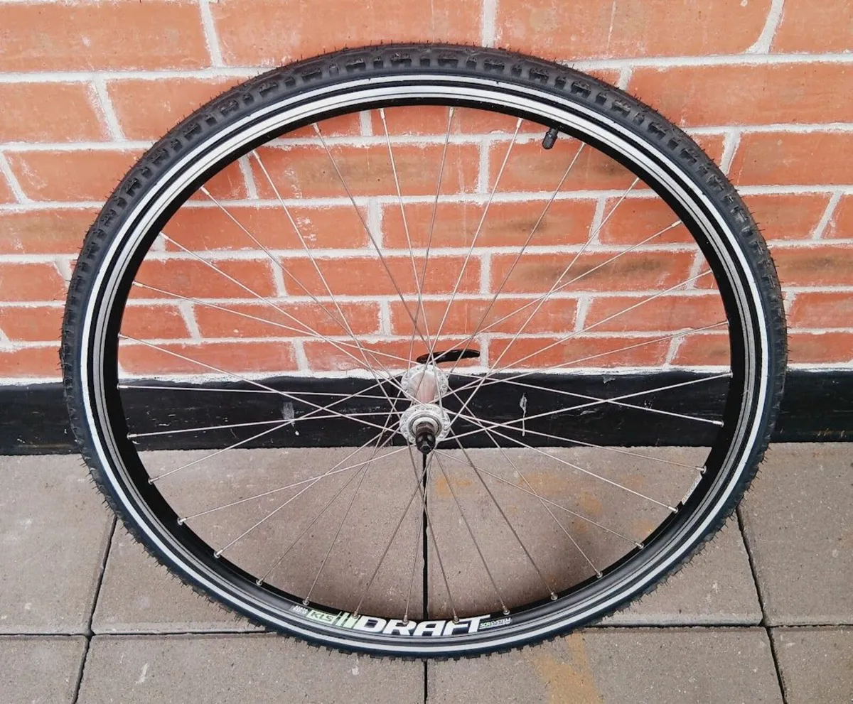 three 28" quick release bike wheels - Image 1