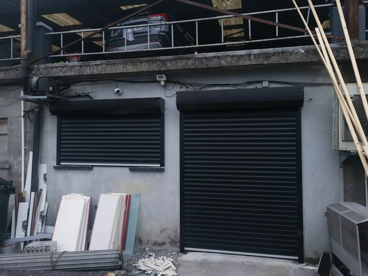 insulated  roller  door  black  2.5  x  2.5 - Image 1