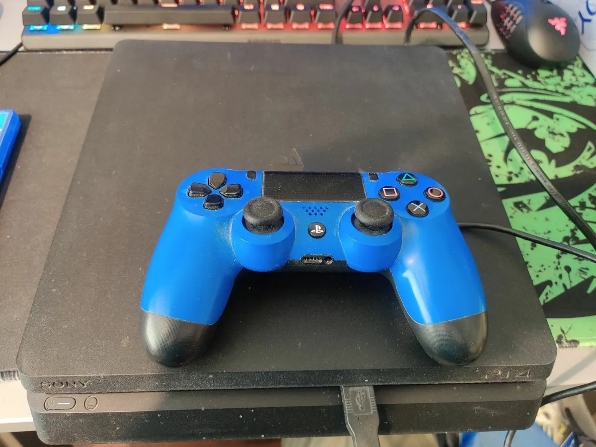 PlayStation 4 Slim 1TB + Games - Image 1