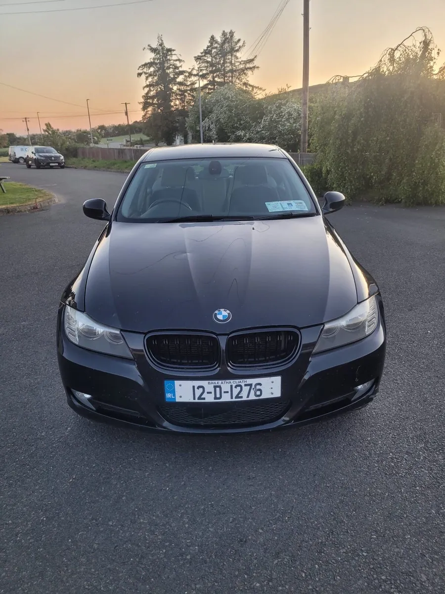 2012 BMW 3 series black - Image 1