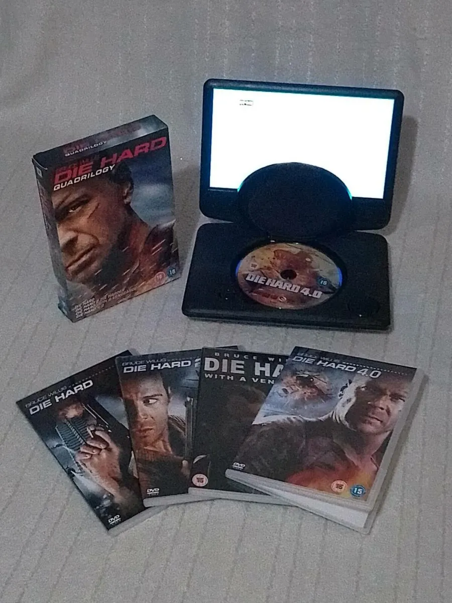 Portable 9" DVD player with wall and car chargers - Image 1