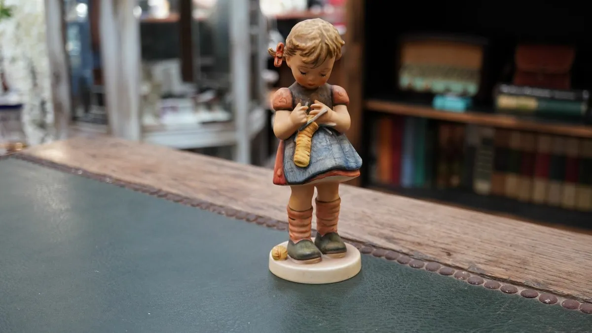 Goebel Hummel Figurine - A Stitch in Time - Image 1
