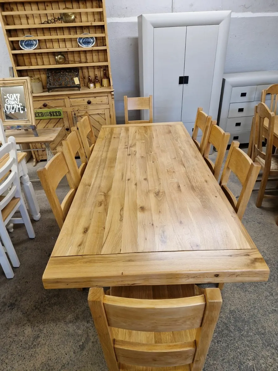 8ft solid light oak trestle table,  8 chairs - Image 2