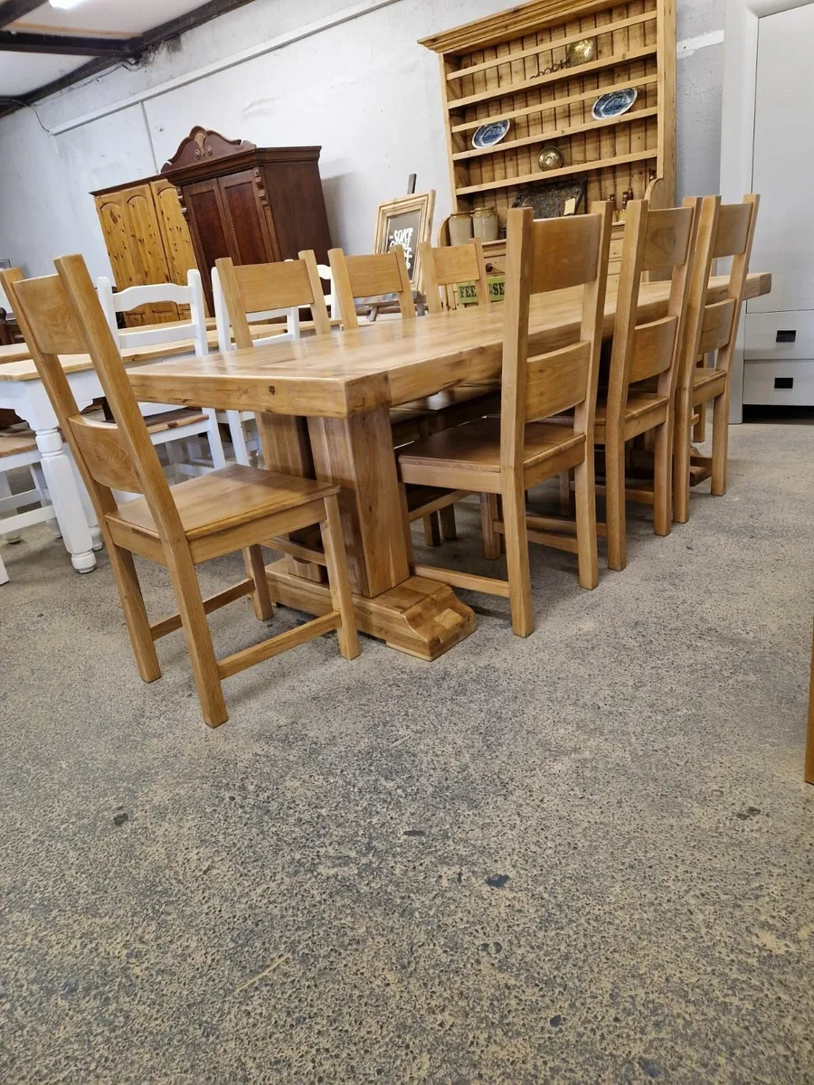 8ft solid light oak trestle table,  8 chairs - Image 3
