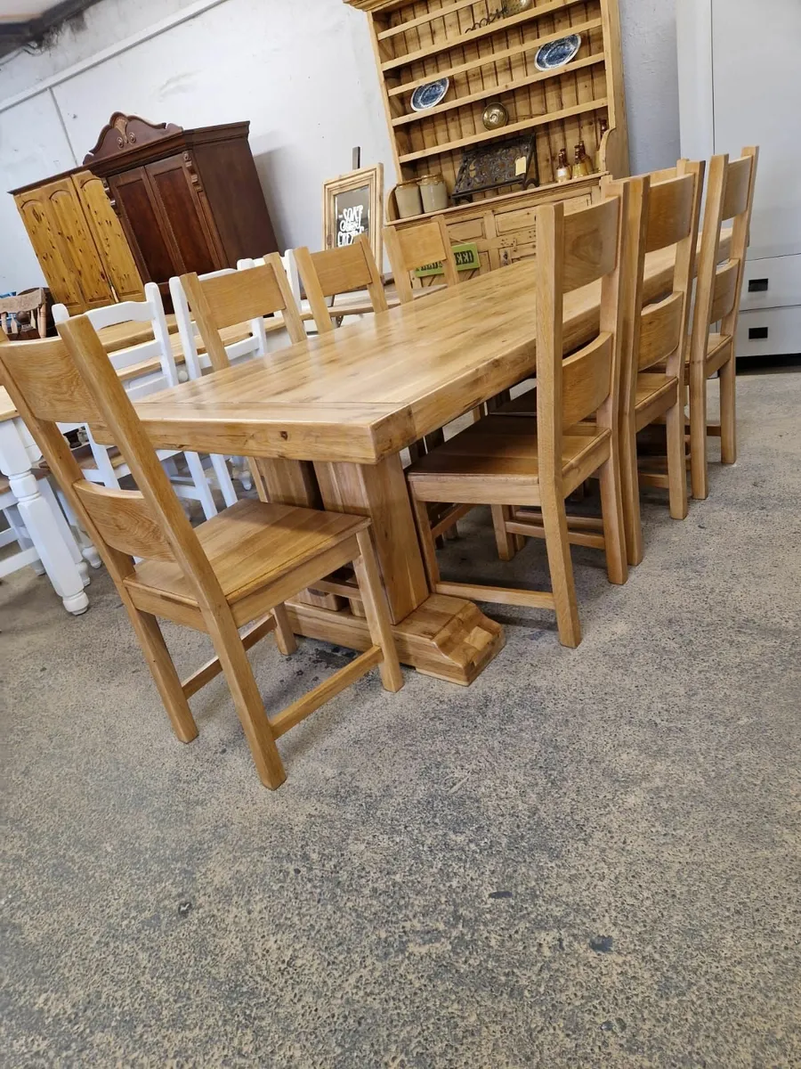 8ft solid light oak trestle table,  8 chairs - Image 1