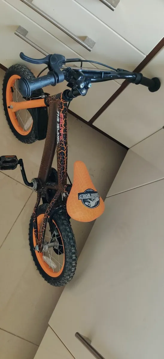 12 Inch Jurassic Park orange black child's bike - Image 1