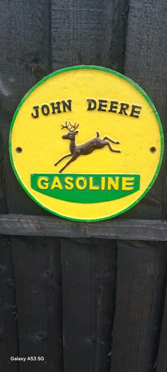 John deer cast iron sign