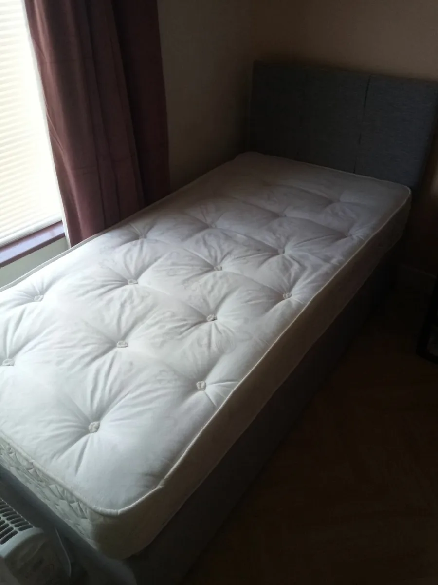 Bed mattress and headboard