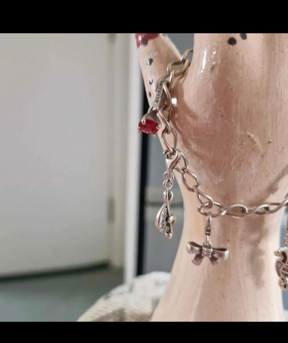 Solid silver charm bracelet/with charms - Image 1