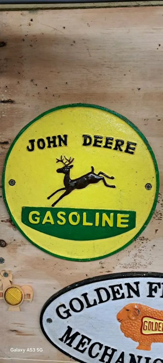 John deer cast iron sign