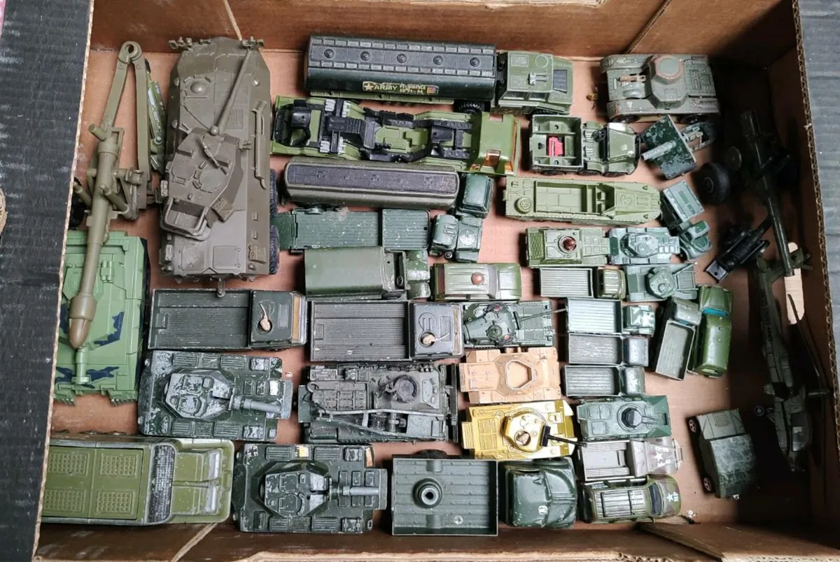 Old model military vehicles.