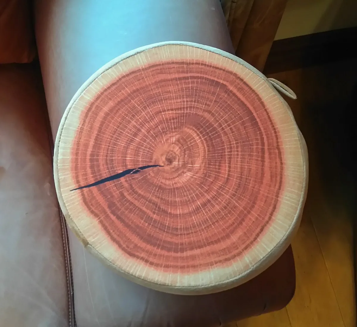 ROUND FLAT CUSHION, LOOKS LIKE TIMBER (NEW). - Image 1