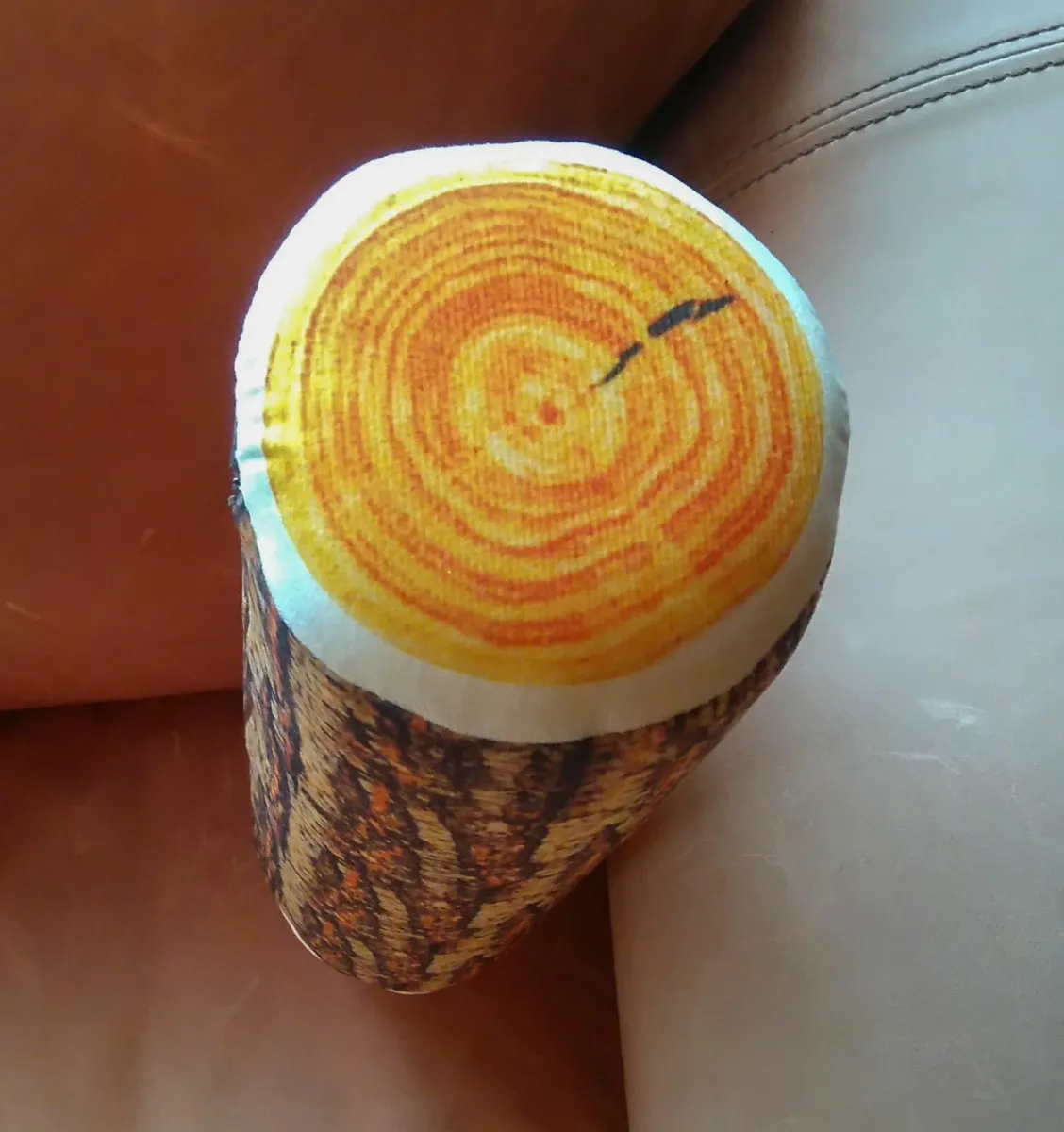 ROUND LOG CUSHION (BRAND NEW). - Image 1