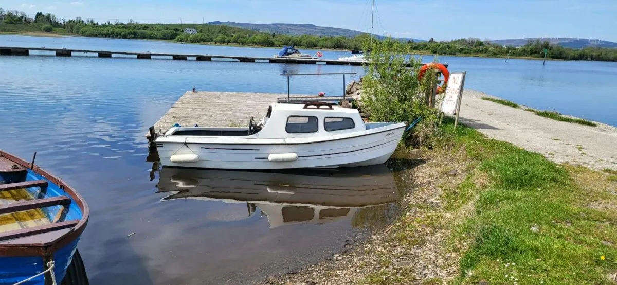 16f cabin boat  and trailer - Image 1