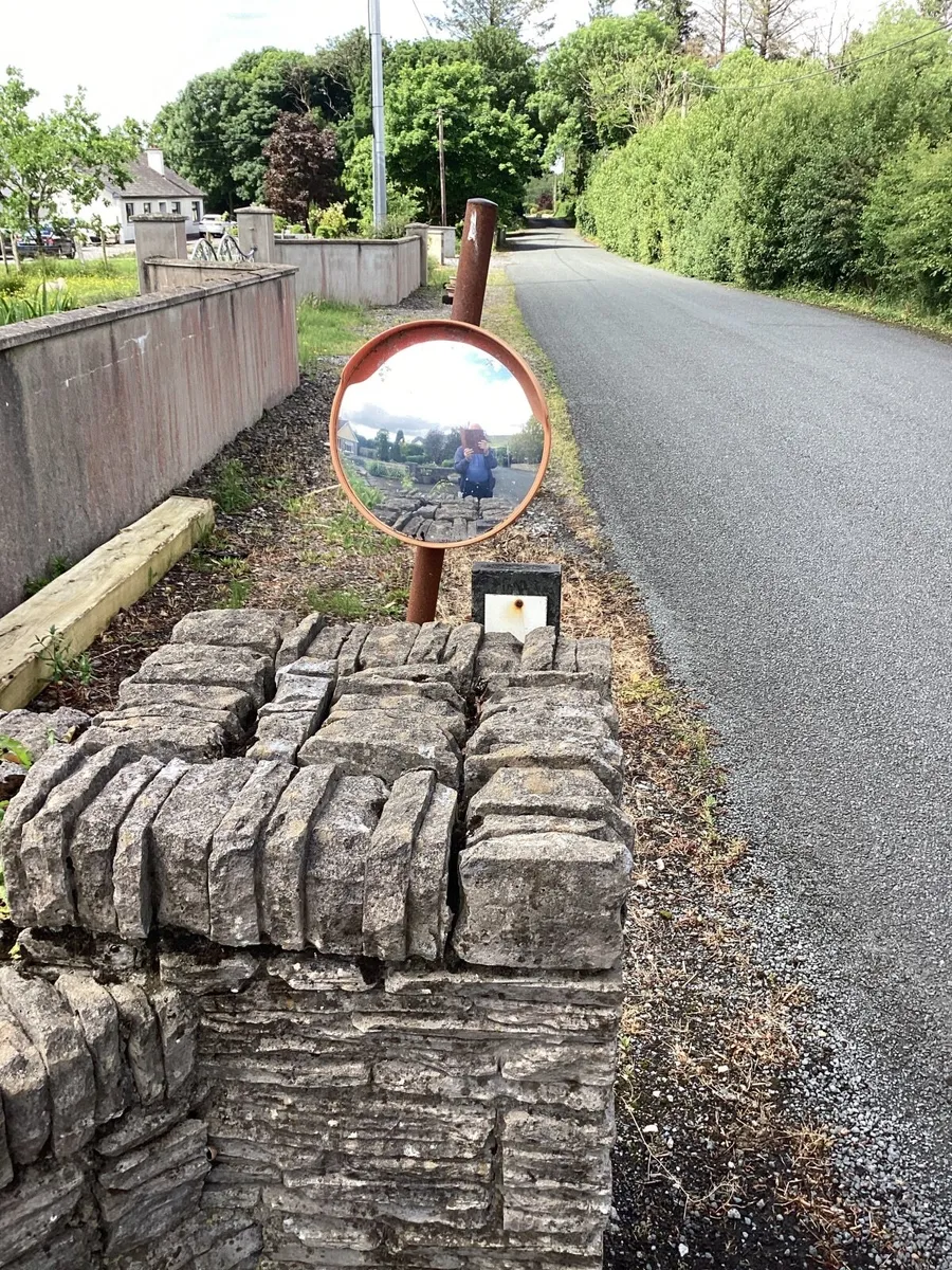 Mirror for viewing traffic on exiting property