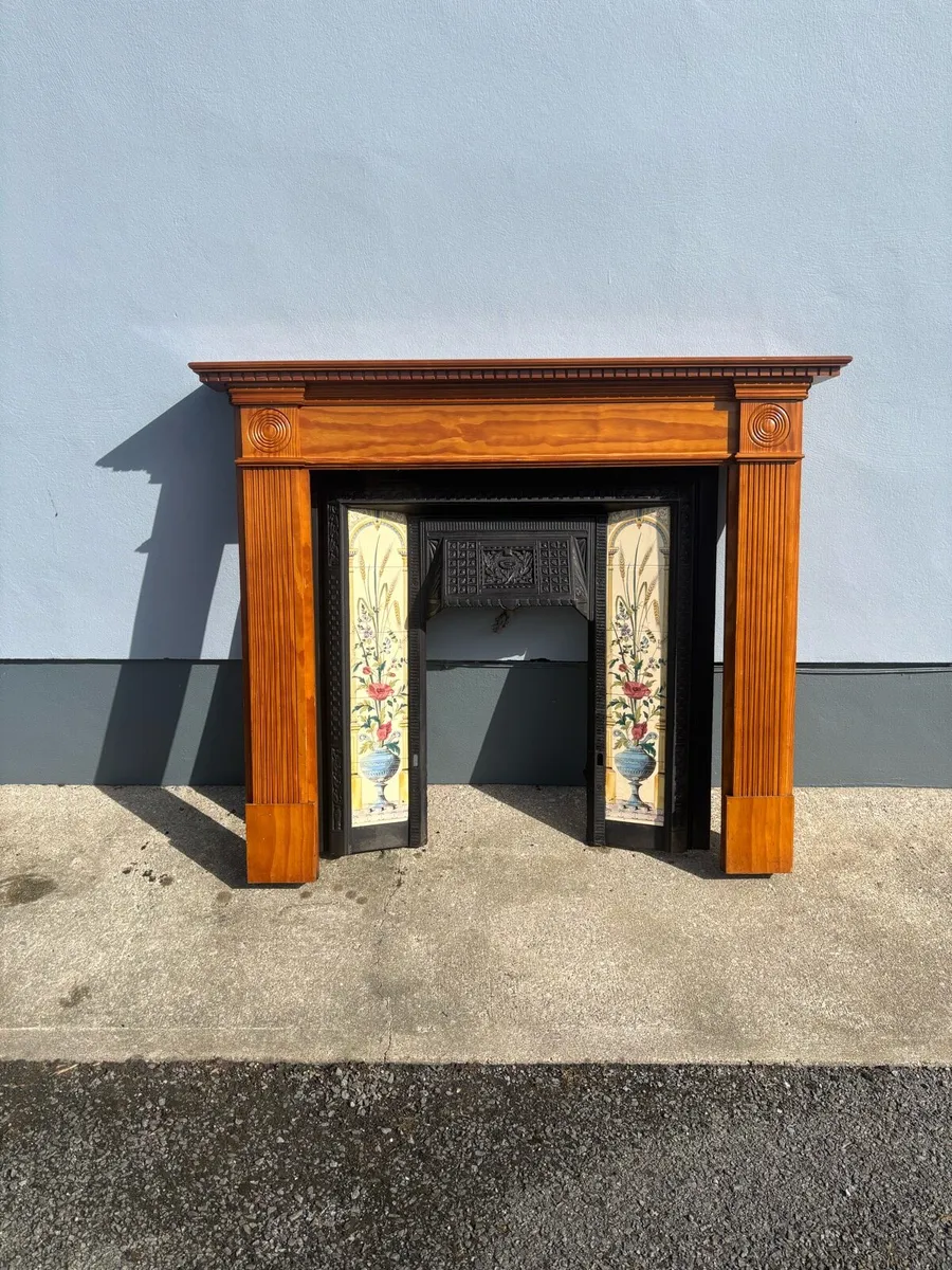 Cast iron fireplace with timber surround - Image 1