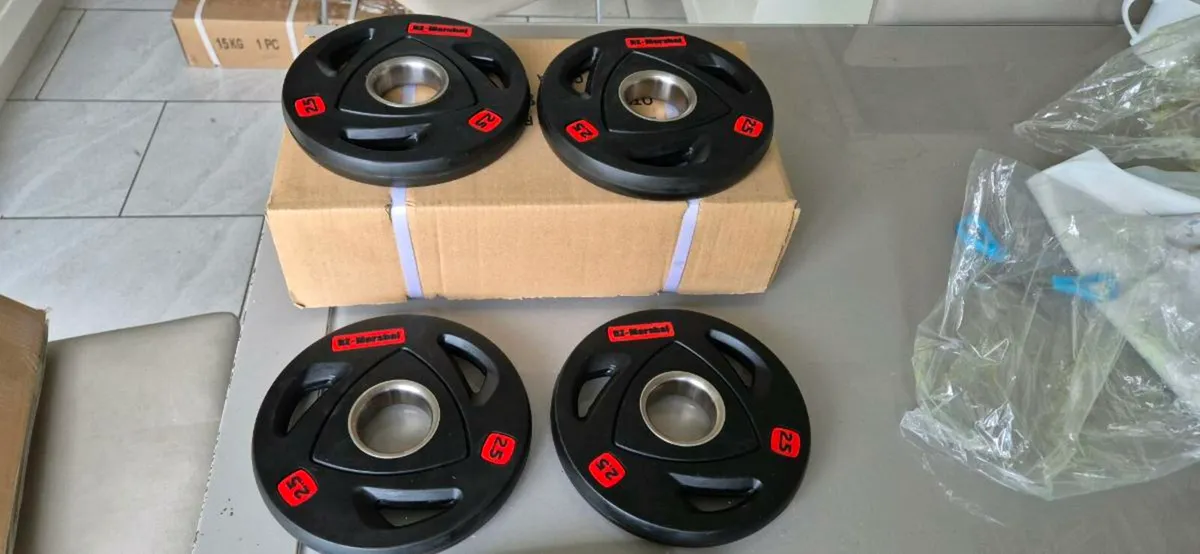 Brand new 4x2.5 kilo Olympic weight plates - Image 1