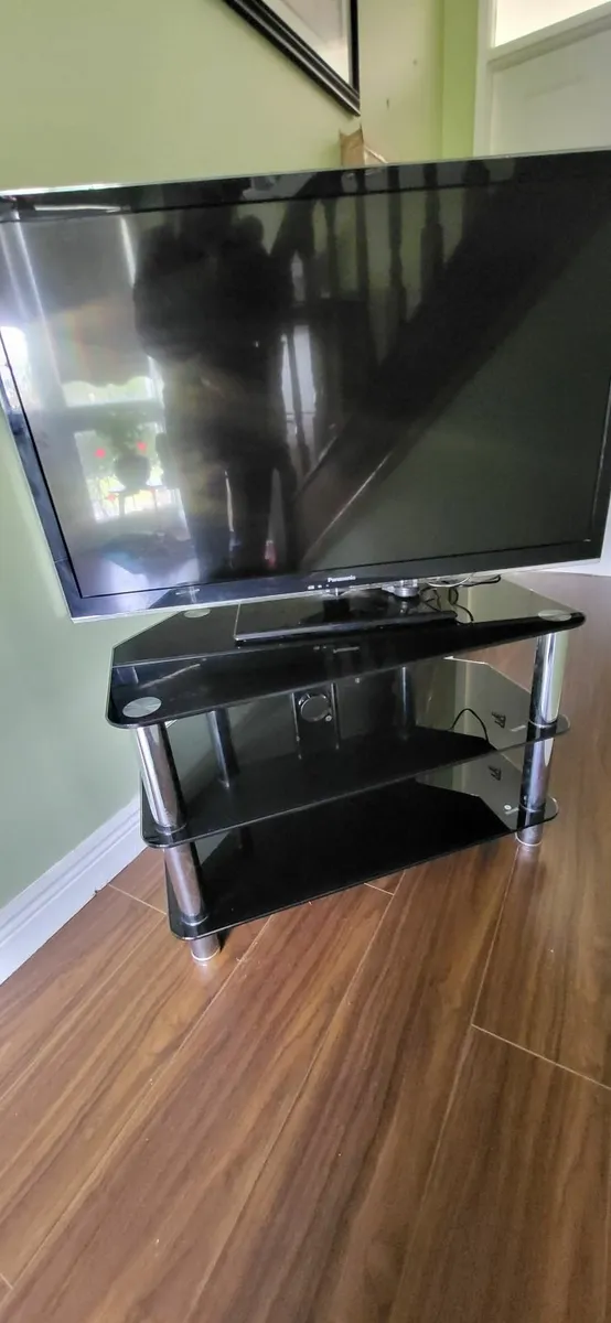 Smart TV with its stand - Image 2