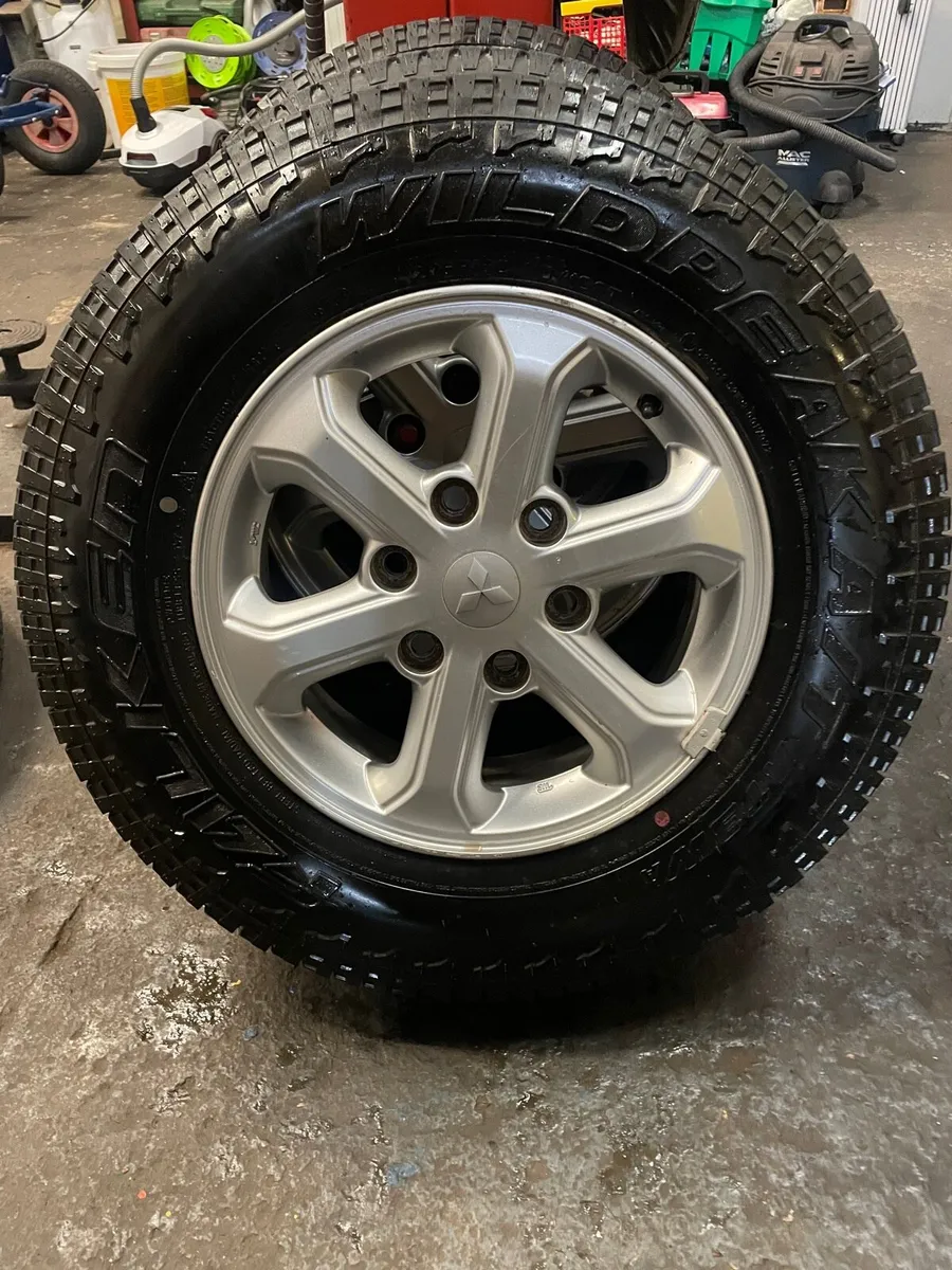 4 Original L200 alloy wheels & tyres as new - Image 1
