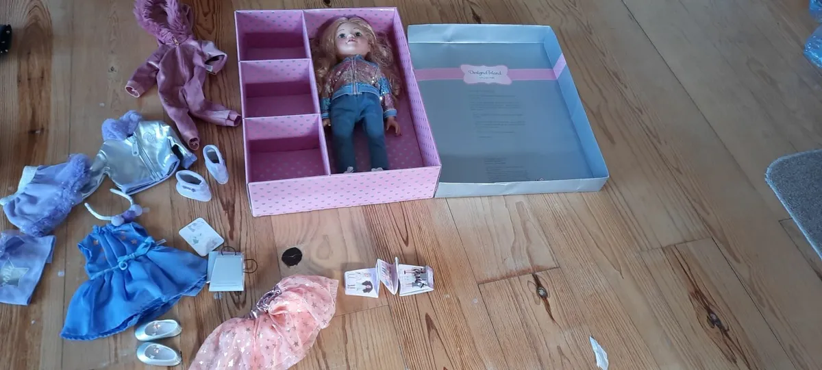 NEW- Designafriend doll in box with various outfit - Image 1