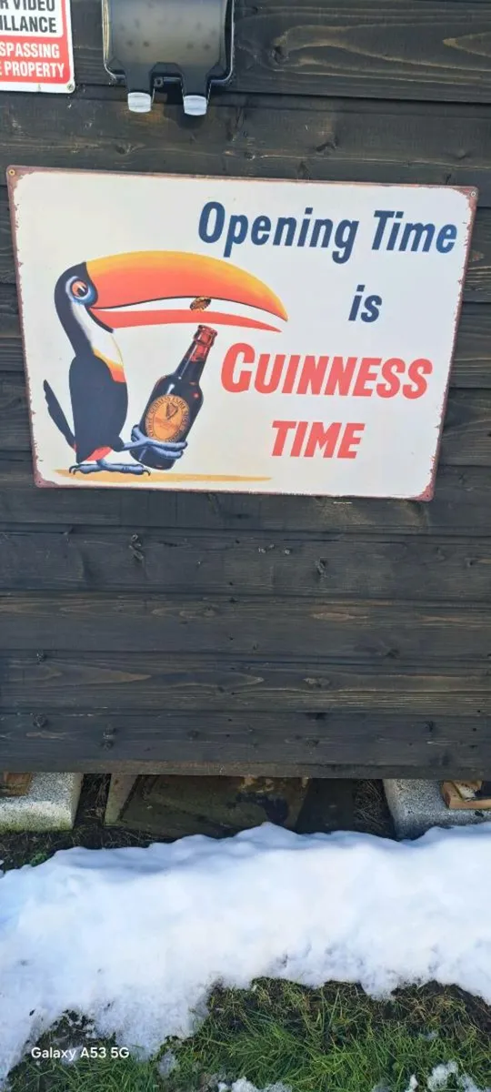 Large Guinness opening times metal sign