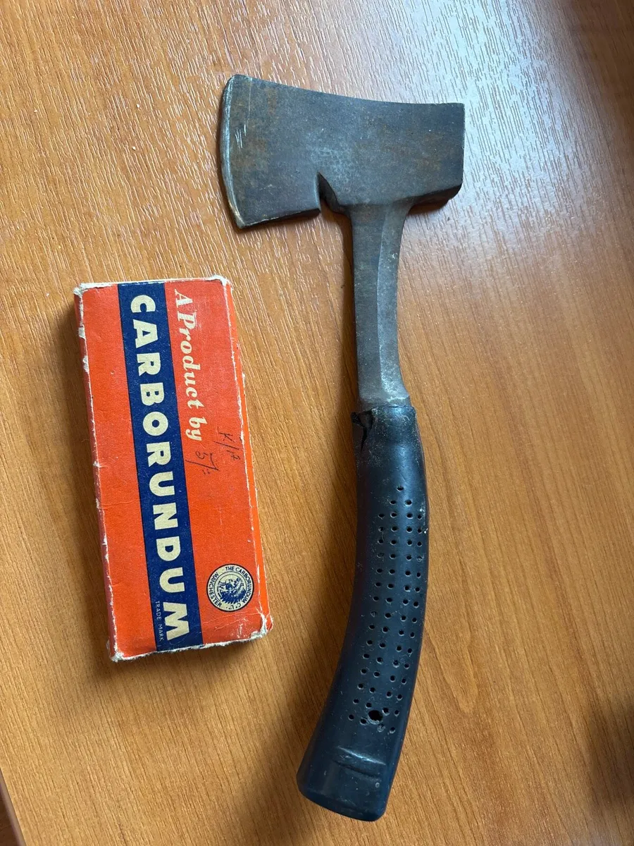 Camping hatchet with stone sharpener