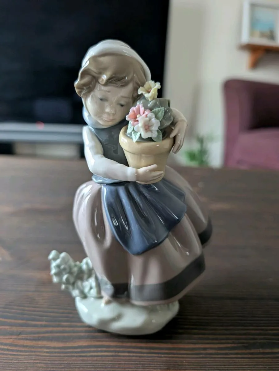 Lladro "Spring is Here" Girl with flowers figurine - Image 1