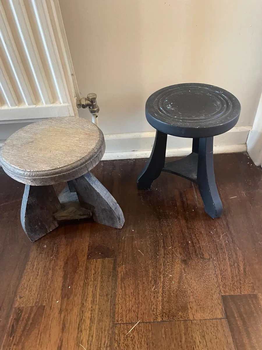 TWO SENUFO ‘MILKING’ STOOLS