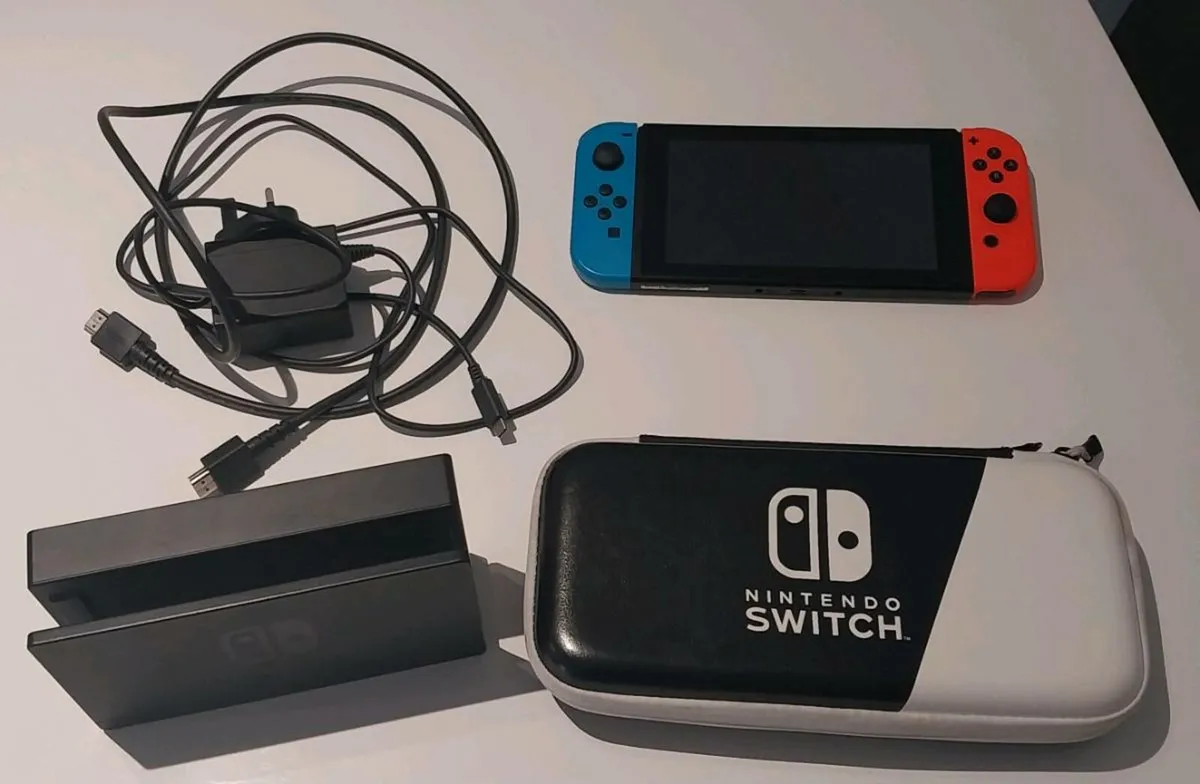 Nintendo Switch + 8 Games, Charger & Case - Image 1