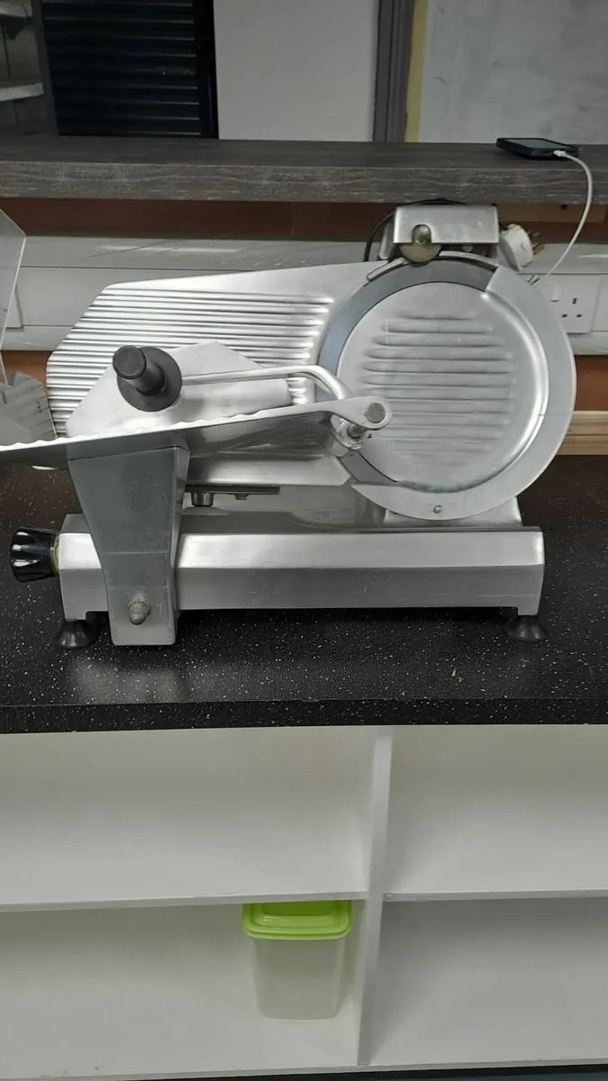 stainless steel counter top meat slicer. - Image 1