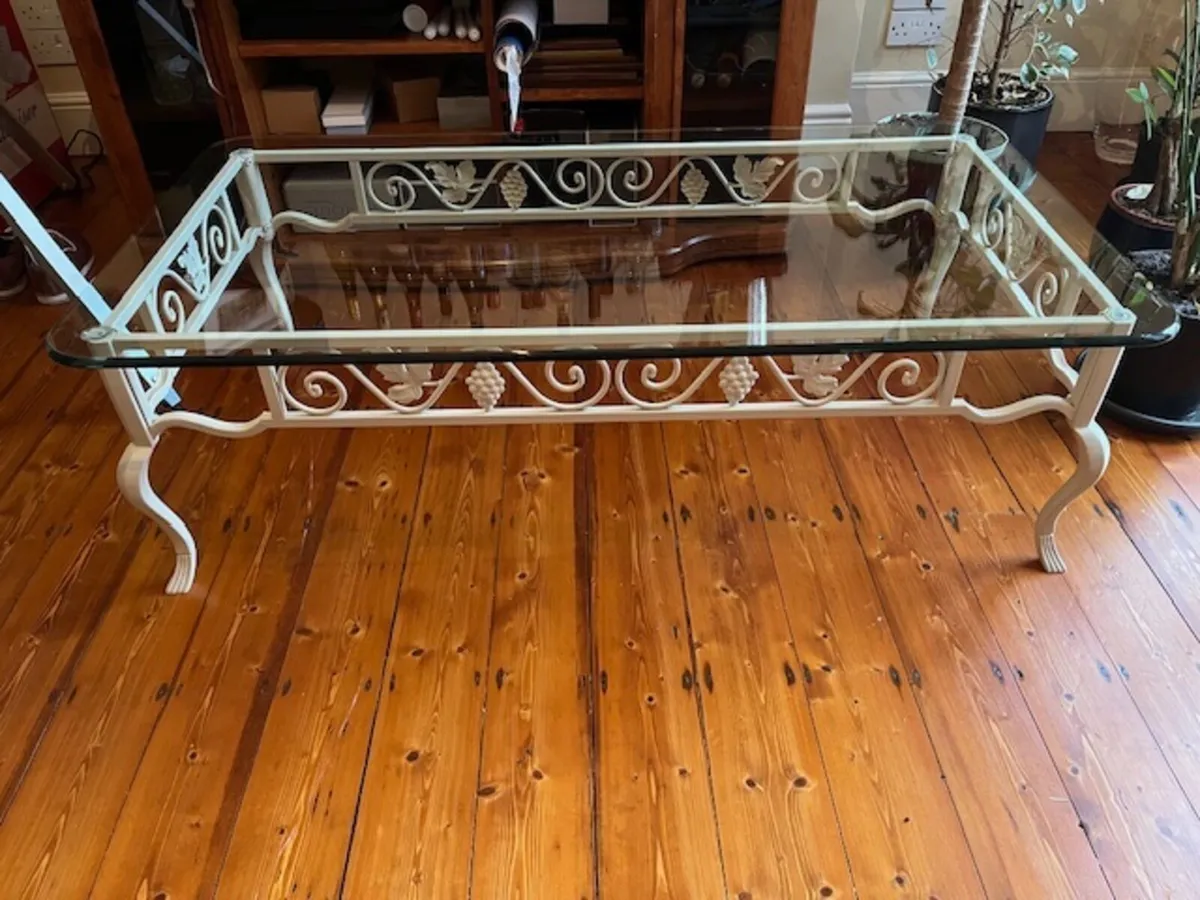 Glass coffee table with cream-painted metal base - Image 1