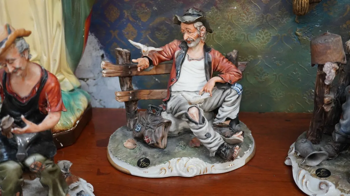 🧓 Porcelain Figurine of Seated Elderly Man with B - Image 1