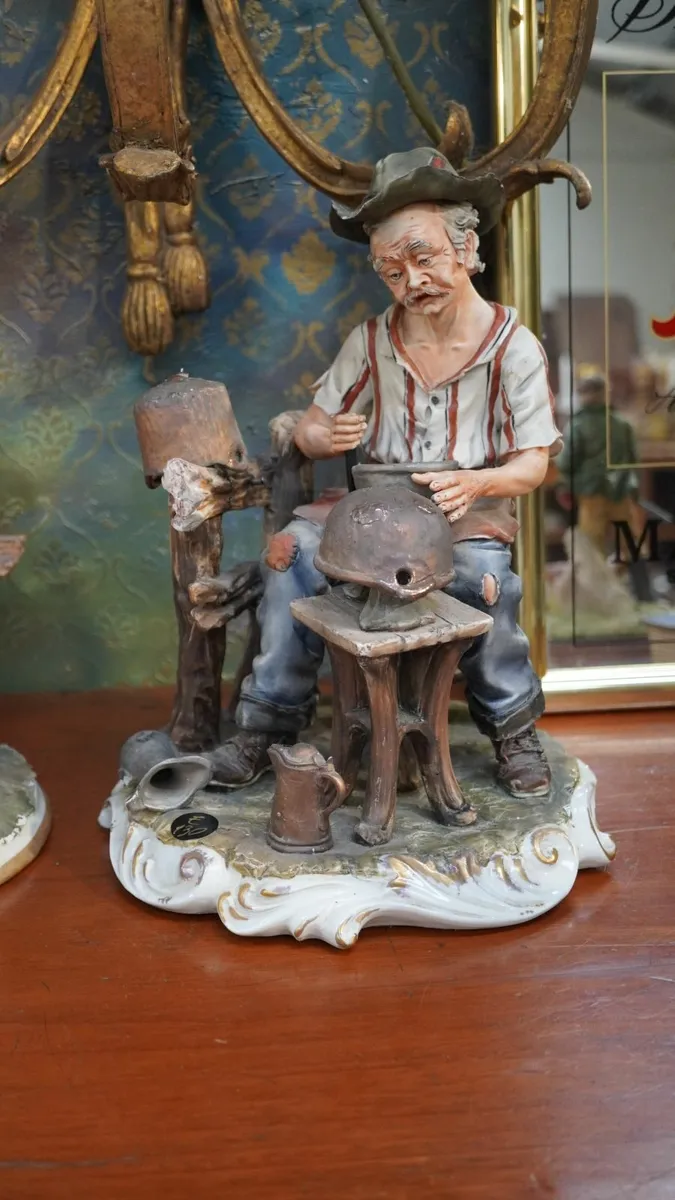 Porcelain Figurine – “Helmet Maker” by Marini - Image 1