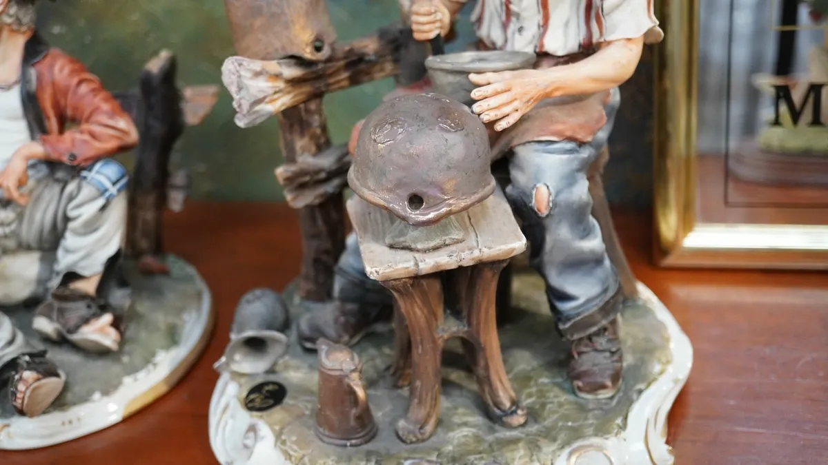 Porcelain Figurine – “Helmet Maker” by Marini - Image 3