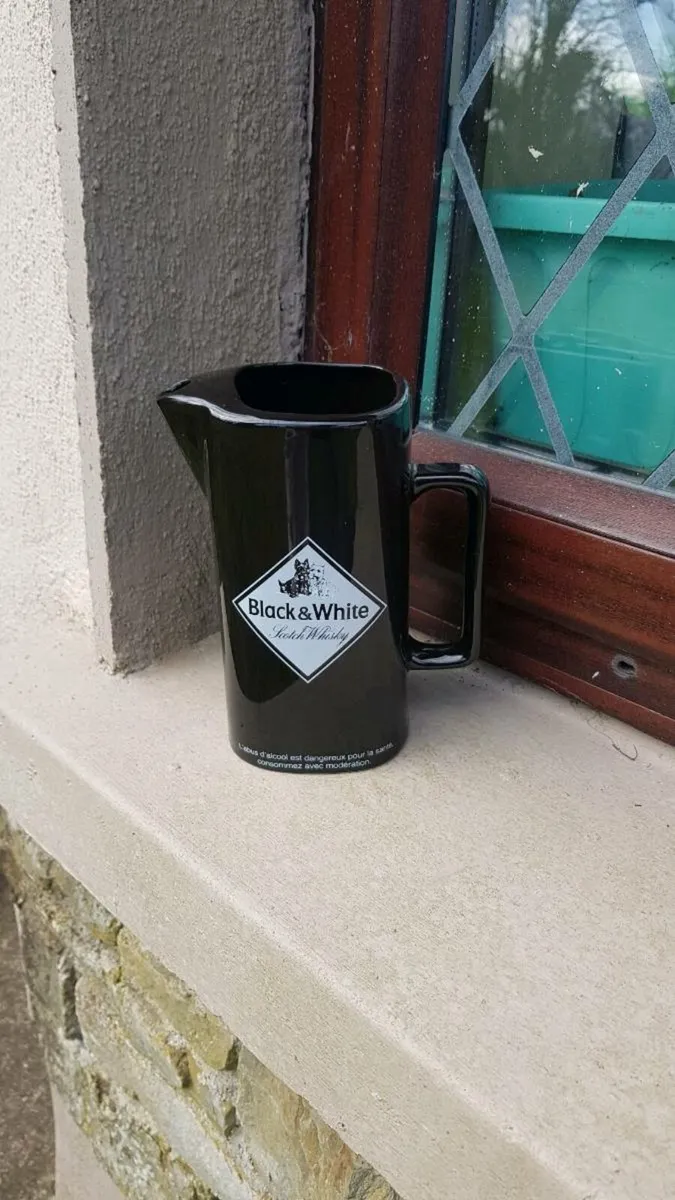 Black and white pitcher postage possible